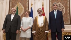 U.S. Secretary of State John Kerry (right),EU adviser Catherine Ashton (second left), Iranian Foreign Minister Javad Zarif (left) and Omani Minister Responsible for Foreign Affairs Yussef bin Alawi (second right) pose for a photo in Muscat on November 9.