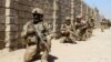 Afghan National Army commandos take position during a military operation in Helmand Province on October 9.