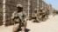 Afghan National Army commandos take position during a military operation in Helmand Province on October 9.