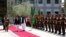 Afghan President Ashraf Ghani and Pakistani Prime Minister Shahid Khaqan Abbasi inspect the honor guard at the presidential palace in Kabul on April 6.