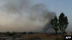 Smoke rises over the city of Ghazni after Taliban militants launched an attack on the Afghan provincial capital late on August 9. 