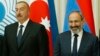 Russia - Armenian Prime Minister Nikol Pashinian and Azerbaijani President Ilham Aliyev pose for a photograph at a summit of ex-Soviet states in Saint Petersburg, December 6, 2018.