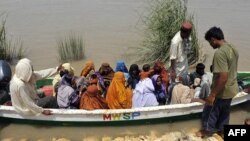 Pakistani military personnel evacuate flood survivors in Ghotki district on August 12.