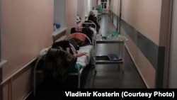 Patients lie in the corridor of a hospital in Vologda in northern Russia. 