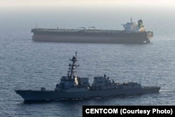 Guided-missile destroyer USS Rafael Peralta (DDG 115) enforces the US blockade of Iranian ports against the ship M/T Stream after it attempted to sail to an Iranian port, on April 26.
