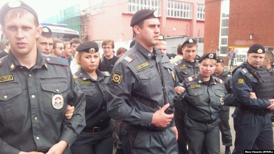 Russian police gather outside the Investigative Committee building in Moscow on June 16.