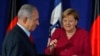 Israeli Prime Minister Benjamin Netanyahu and German Chancellor Angela Merkel give a joint press conference at a hotel in Jerusalem, October 4, 2018