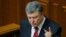 President Petro Poroshenko told parliament on June 4 that more than 9,000 Russian soldiers are currently in Ukraine, and that Ukraine's military must be prepared for the possibility of "a full-scale invasion along the entire length of the border with Russia."
