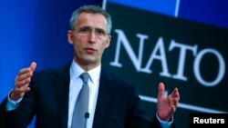 NATO Secretary-General Jens Stoltenberg speaks to reporters in Brussels about the alliance's plans to bolster its eastern flank.
