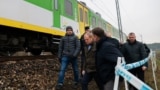 Polish Prime Minister Donald Tusk surveys the site of damaged railway tracks on the Warsaw-Lublin line on November 17 in Mika after an explosion that he called an "unprecedented act of sabotage."