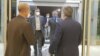 IAEA Director-General Rafael Grossi (in blue mask) arrives at Tehran's airport on September 11. 