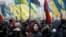 People attend a rally in front of the Ukrainian parliament on January 16, calling for lawmakers to recognize Russia as an aggressor state and implement other legislative changes concerning the occupied parts of eastern Ukraine. 
