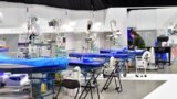Sweden - A member of military personnel works to prepare a field hospital which will provide extra intensive care space for patients with coronavirus disease (COVID-19), 