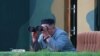 NORTH KOREA -- North Korean leader Kim Jong Un watches the test-fire of two short-range ballistic missiles at an undisclosed location, July 25, 2019