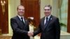 Turkmen President Gurbanguly Berdymukhammedov (right) meets with Russian Prime Minister Dmitry Medvedev in Turkmenbashi on August 12. 