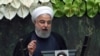 Iranian President Hassan Rohani delivers a speech during the inaugural session of the new parliament following February elections, in Tehran, May 27, 2020