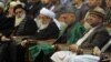 President Hamid Karzai (second from right) attends a Loya Jjirga gathering of tribal and political leaders in 2011.