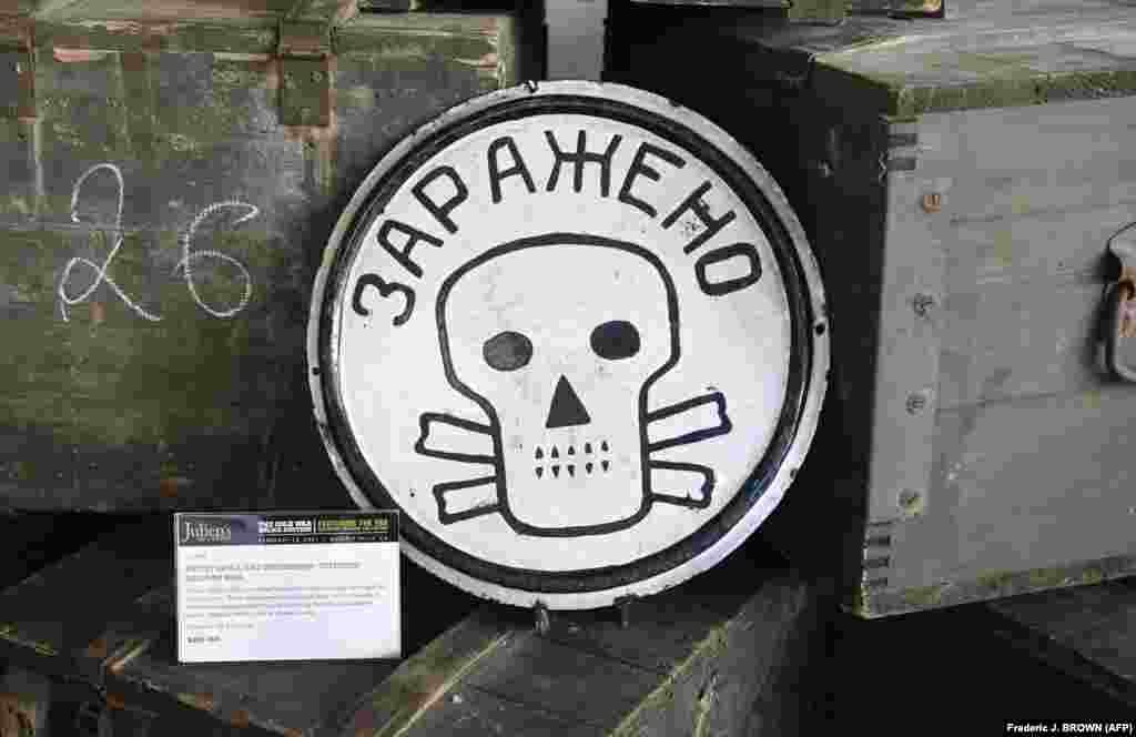 A skull-and-crossbones railway sign with the inscription: Contaminated. The sign was used in the 1950s and &#39;60s to indicate to railway workers and passengers that they were passing through a sector with possible nuclear, chemical, or biological contamination.