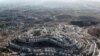 U.S. Gives Up On Settlement Freeze