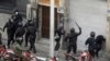 Iranian security forces on motorcycles surround opposition protesters during clashes in Tehran on December 27, 2009.