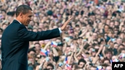 U.S. President Barack Obama waves after speaking at Prague Castle 