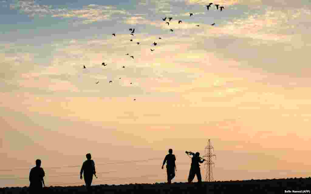 Iranian Kurdish Peshmerga, members of the Iranian Kurdistan Democratic Party (KDP-Iran), take part in routine military exercise in Koya, 100 kilometers east of Irbil, on October 22. (AFP/Safin Hamed)