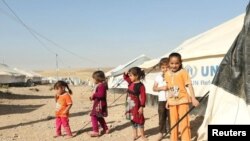 Displaced Iraqi children who fled Mosul are pictured at a refugee camp in Iraq earlier this month. 