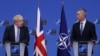 British Prime Minister Boris Johnson and NATO Secretary-General Jens Stoltenberg hold a joint news conference in Brussels on February 10. 