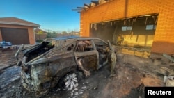 Scenes of destruction in Tsyrkuny in late May, as Ukrainian troops drove the Russians out.