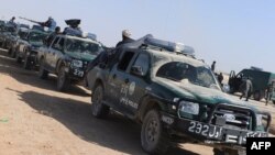 FILE: An Afghan police convoy in Helmand province