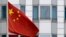 The Chinese flag is pictured in front of the building of the Chinese embassy in Berlin on April 22, 2024.