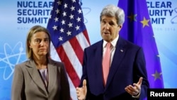 U.S.- U.S. Secretary of State John Kerry meets with European Union High Representative Federica Mogherini (L) at the Nuclear Summit in Washington April 1, 2016. 
