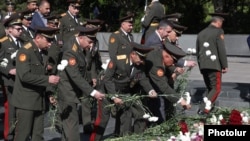Armenia - Armenian military officials lay flowers at a World War II memorial in Yerevan, May 9, 2025.