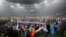 Dnipro Dnipropetrovsk's fans storm the field in celebration after their team's semifinal match against Napoli in Kyiv on May 14.