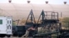 A U.S. soldier moves a maintenance stand at Karshi-Khanabad Air Base.