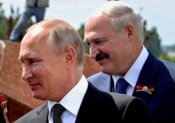 Russian President Vladimir Putin (left) and his Belarusian counterpart, Alyaksandr Lukashenka (file photo)