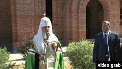 A screen grab of Russia's Orthodox Patriarch Kirill blessing the cornerstone of a new church outside the academy of the Federal Security Service on August 1.