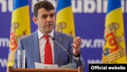 Moldovan Prime Minister Chiril Gaburici announces his resignation in Chisinau on June 12.