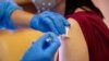 SLOVAKIA -- A woman receives the first dose of the Sputnik V vaccine against the COVID-19 coronavirus in Bratislava, June 7, 2021