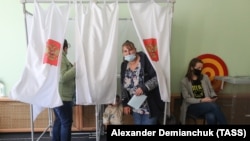 Women vote in the 2020 gubernatorial election of Russia's Leningrad region in 2020.