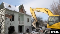 A home is demolished in the Moscow suburb of Rechnik.