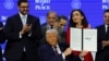 US President Donald Trump holds a signed charter of the Board of Peace at the World Economic Forum in Davos, Switzerland, on January 22. 