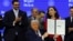 US President Donald Trump holds a signed charter of the Board of Peace at the World Economic Forum in Davos, Switzerland, on January 22. 