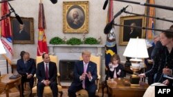 US President Donald Trump (R) speaks during a meeting with Egyptian President Abdel Fattah el-Sisi in the Oval Office at the White House in Washington, DC, on April 9, 2019. (Photo by Jim WATSON / AFP)