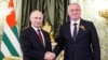 Владимир Путин, Бадра Гунба (справа)