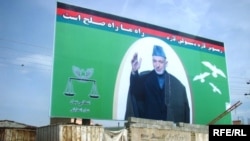 A large campaign poster for incumbent Afghan President Hamid Karzai