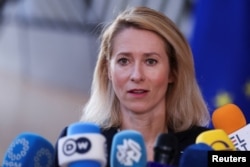 EU foreign policy chief talks to reporters in Brussels on March 16.
