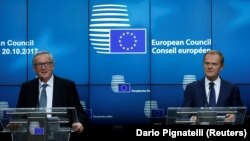BELGIUM -- European Commission President Jean-Claude Juncker (L) and EU Council President Donald Tusk hold a joint news conference during a European Union leaders summit meeting in Brussels, October 20, 2017