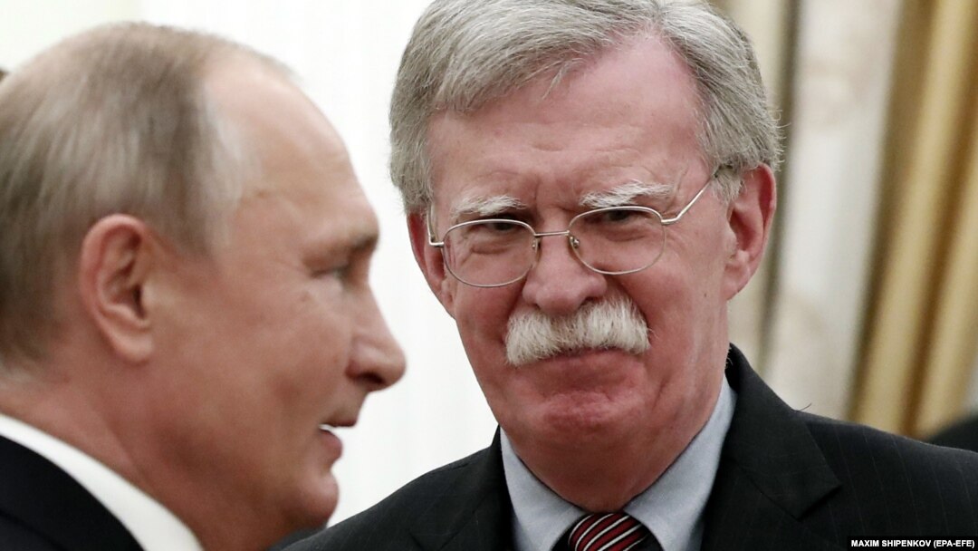 Russian President Vladimir Putin (left) meets with U.S. national-security adviser John Bolton in Moscow on October 23. 