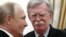 Russian President Vladimir Putin (left) meets with U.S. national-security adviser John Bolton in Moscow on October 23. 